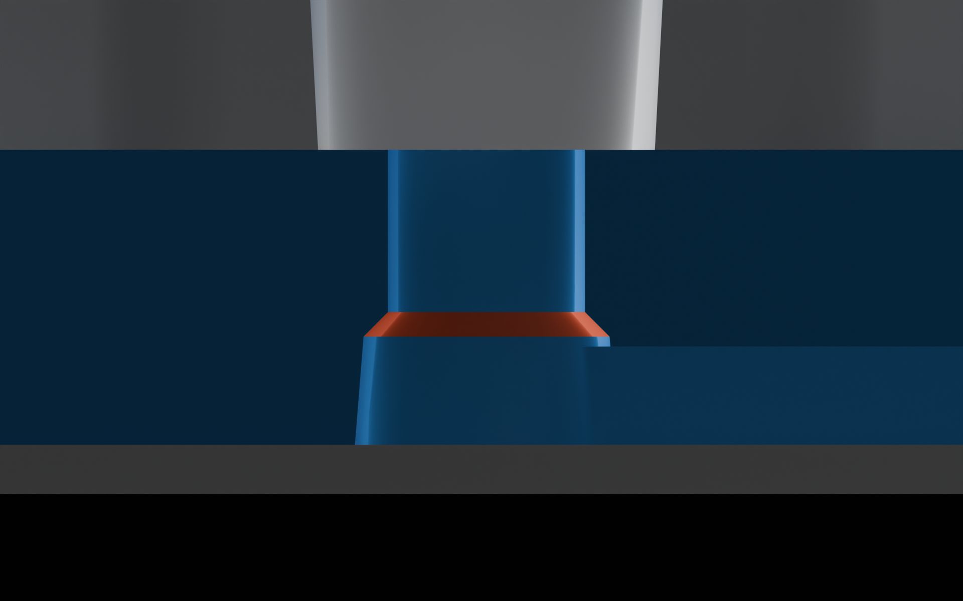 Close-up of the via’s chamfer under a 1/4-28 port. The chamfer is 125 µm in height and width, at a 45° angle with vertical walls of the machined portion. The chamfer sits 50 µm above the connecting molded microfeature.